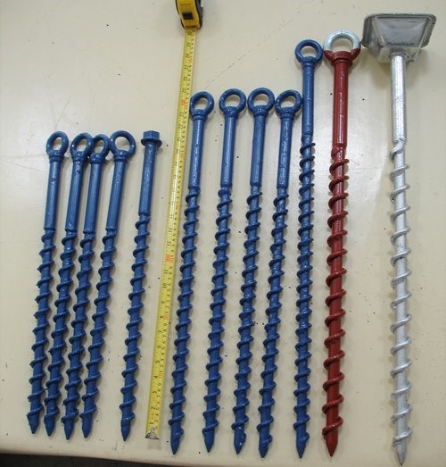 Metal screws used for securing inflatables in soft ground